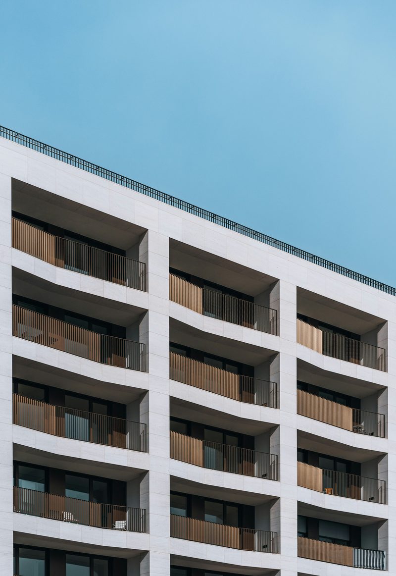 Apartment building facade being surveyed